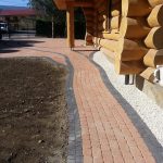 reb brick block paving at a log cabin