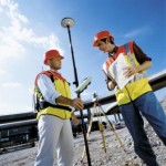 two men performing a survey